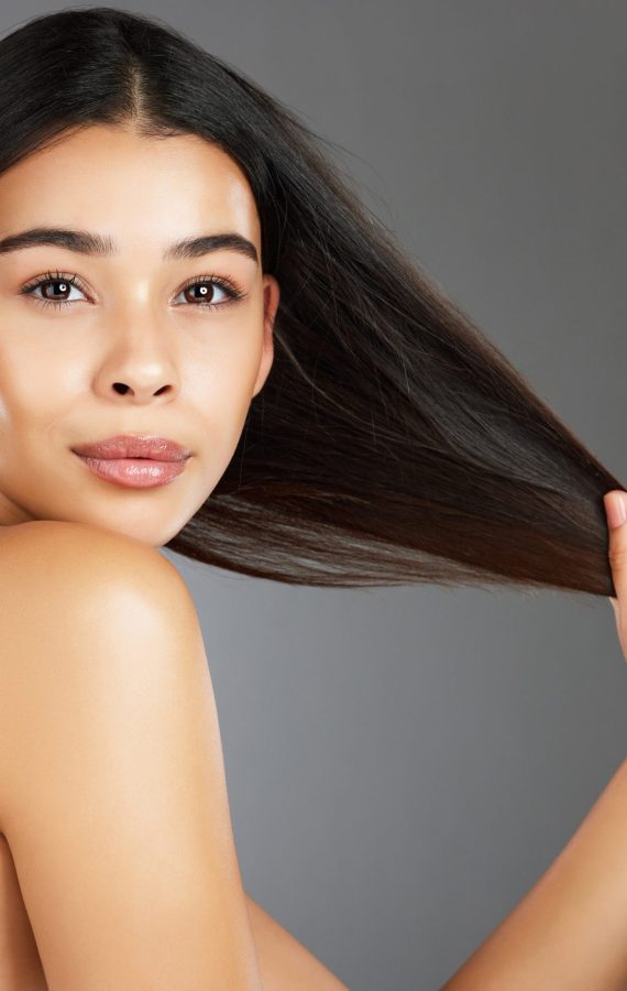 woman-hair-care-and-beauty-in-studio-portrait-for-2025-04-06-09-28-39-utc.redimensionado Woman, hair care and beauty in studio portrait for strong, healthy natural shine and wellness by ba.